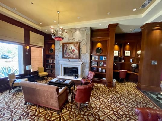 Lounge area with comfortable seating and a fireplace