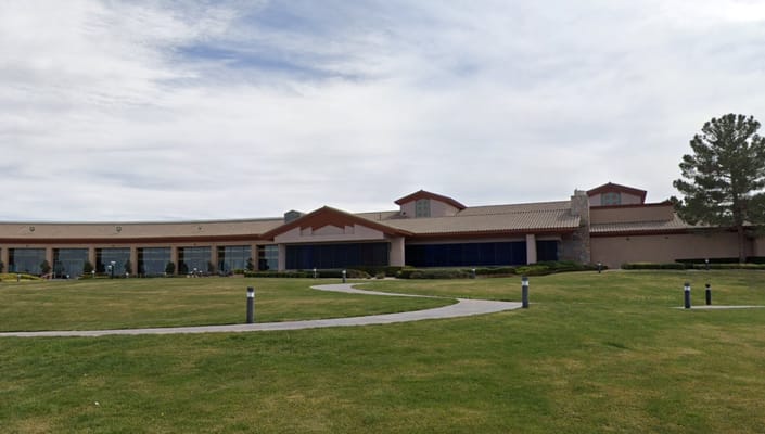 The exterior of Sun City Anthem Center with landscaped grounds.