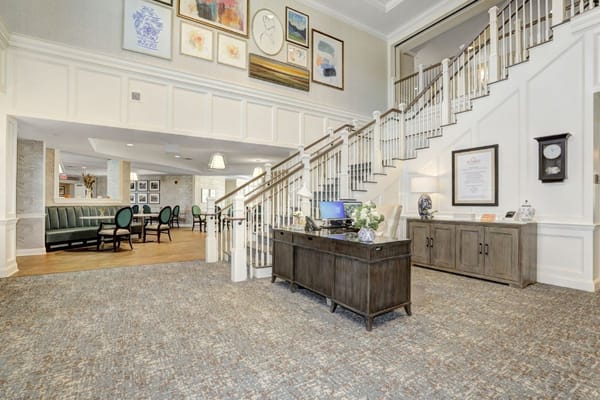 Welcoming lobby with staircase and reception area