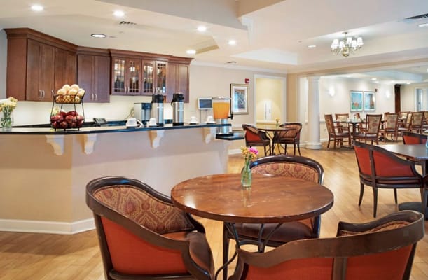 Cozy common area with seating and refreshments at Sunrise of Naperville North.