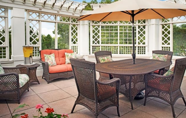 Cozy outdoor patio seating area with table and chairs