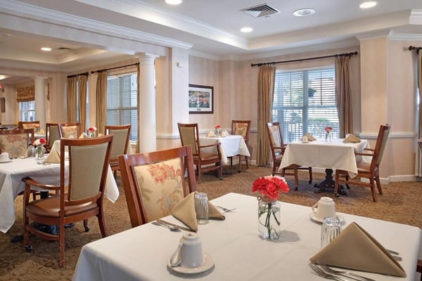 Elegant dining room set up with tables and chairs