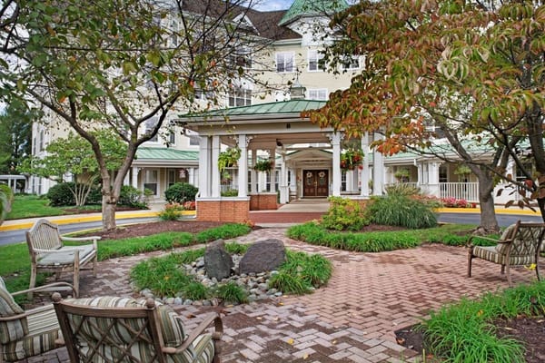 Entrance of Sunrise of Rockville surrounded by landscaped gardens