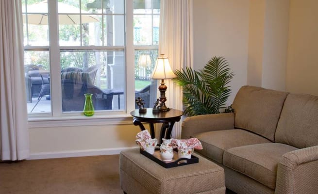 Cozy sitting area with a lamp and plants