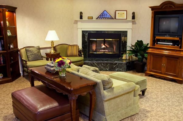 Cozy common area with a fireplace and seating