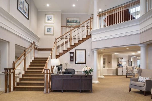 Spacious lobby with stairs and reception desk