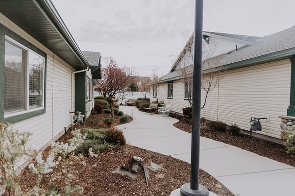 Pathway through a landscaped outdoor area of the facility