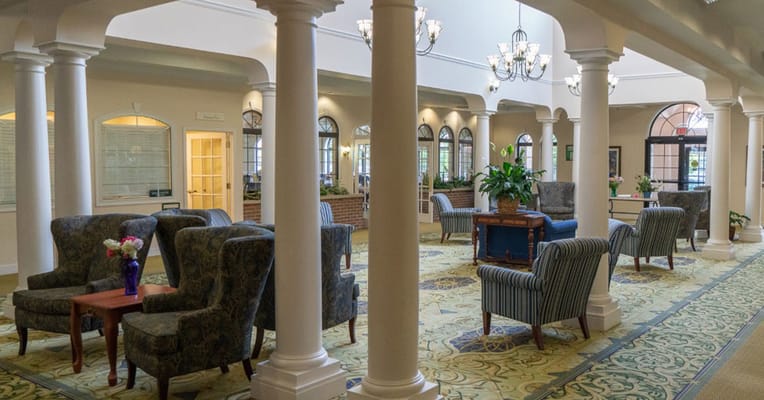 Interior view of a bright common area with seating