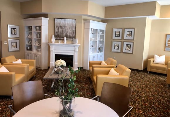 Inviting living room with yellow armchairs and a fireplace