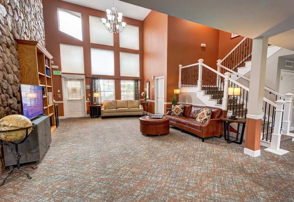 Bright living room with comfortable seating and high ceilings