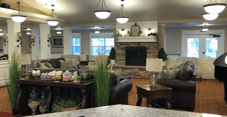 Common area with sofas and a fireplace