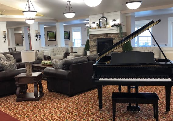 Interior view of a lounge area with a piano