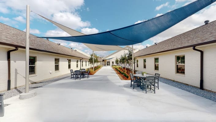 Outdoor courtyard with shaded seating area