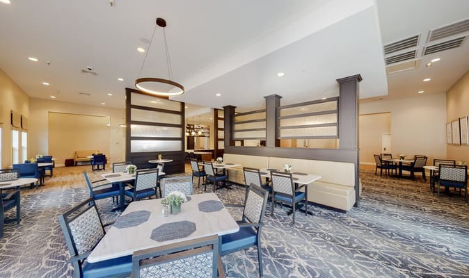 Dining area with tables and chairs set up