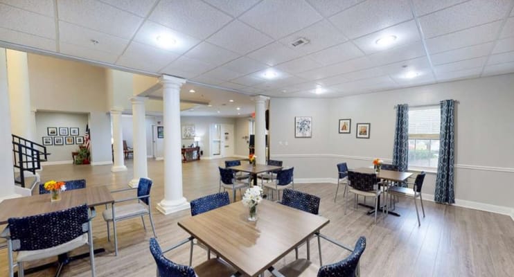 Bright common area with seating and floral decorations