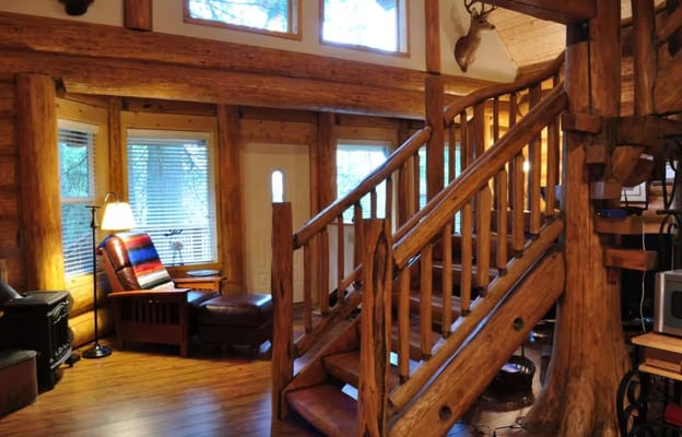Cozy interior with wooden staircase and seating