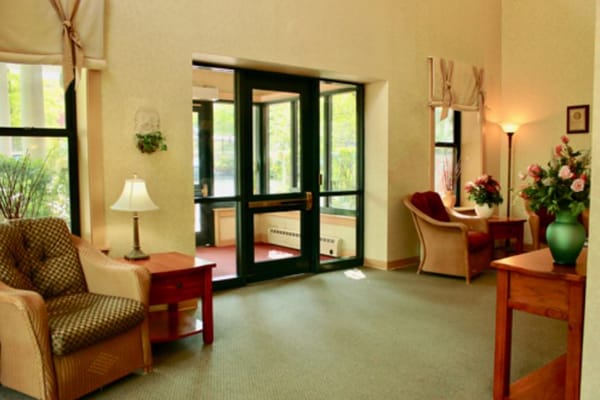 A bright and inviting lobby area with comfortable seating and plants.