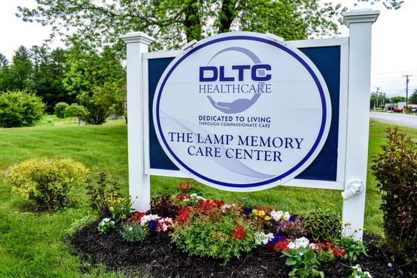 Facility logo sign in a landscaped area