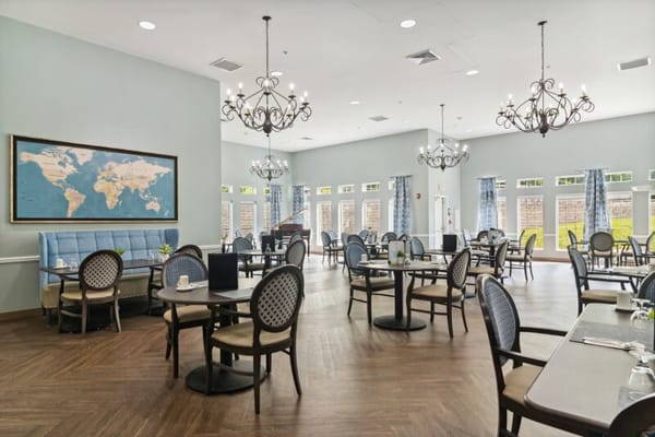 Spacious dining room with tables and chairs in The Landing of Stow