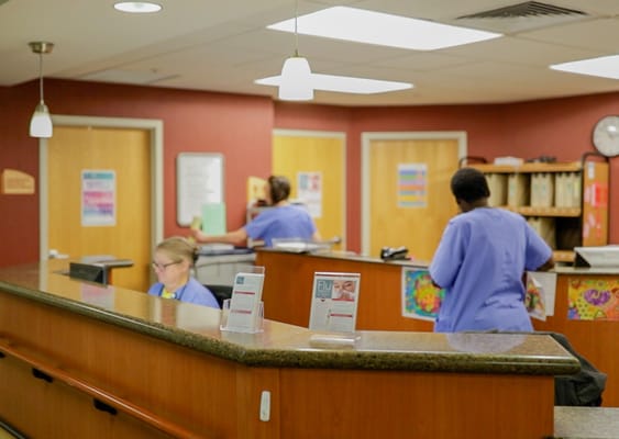 Staff working at the reception area of the facility
