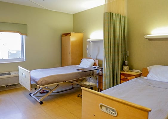 Two patient beds in a shared room