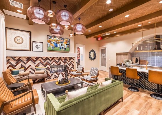 Stylish living room with seating and modern decor in senior living facility.