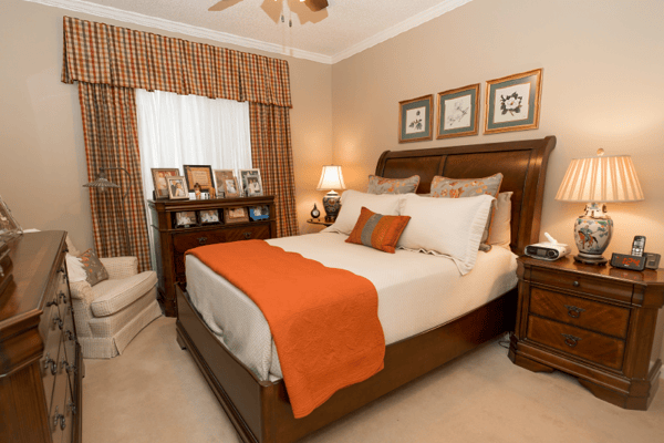 Cozy bedroom with warm decor and personal touches