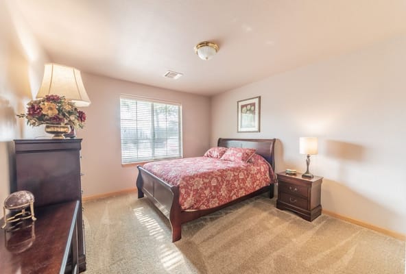 Cozy guest room with floral bedding and natural light