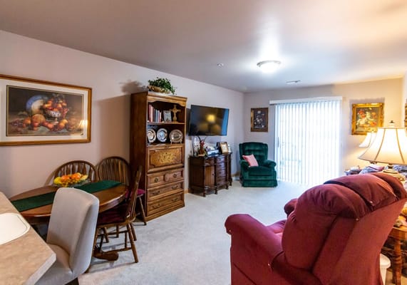 Cozy living room area with a dining table and chairs