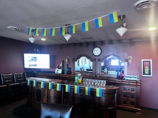 Interior view of a social area decorated with flags