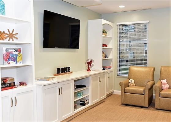 Cozy common area with seating and a TV