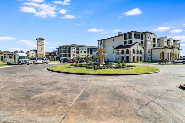 Front entrance of The Vincent with fountain and clock tower