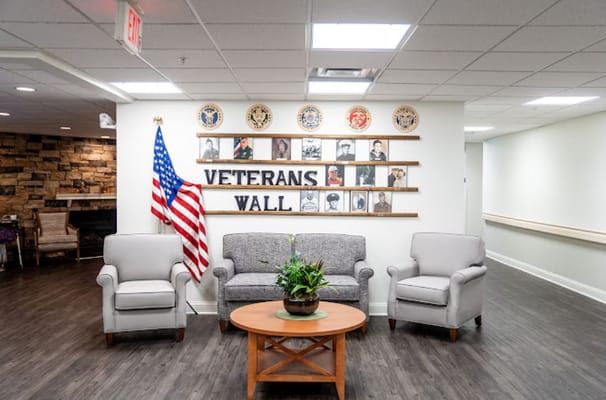 Seating area with Veterans Wall and American flag