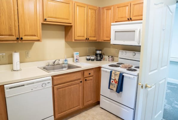 Bright kitchen featuring wooden cabinets and modern appliances