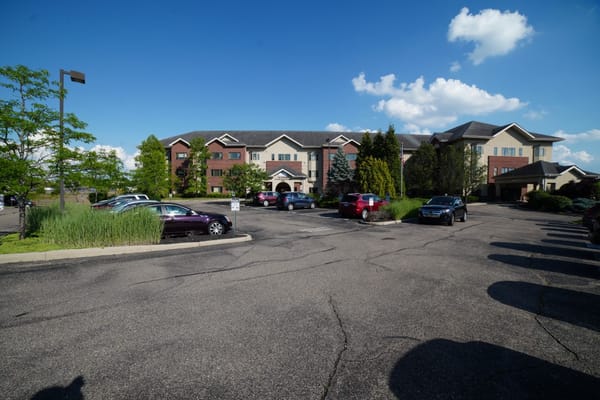 Parking lot and exterior of The Wellington at North Bend Crossing