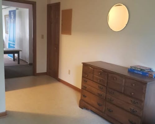 Interior view of a hallway and dresser