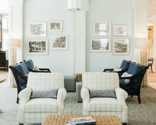 Comfortable seating in a bright living room with art on the walls