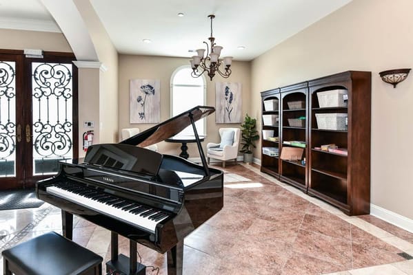 Interior view of a welcoming lobby with a piano
