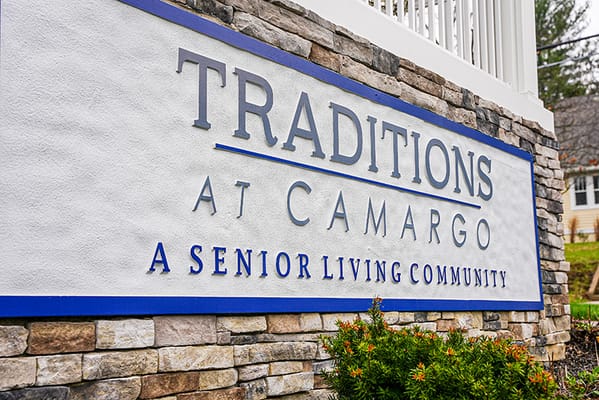 Facility logo at the entrance of Traditions at Camargo