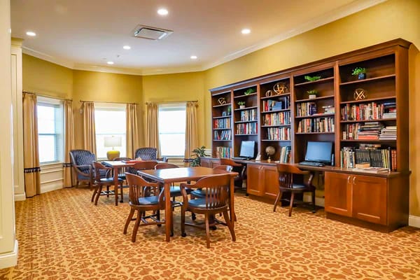 Interior view of a common area with bookshelves and seating
