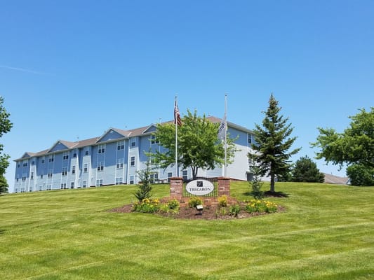 Exterior view of Tregaron Senior Apartments with landscaping