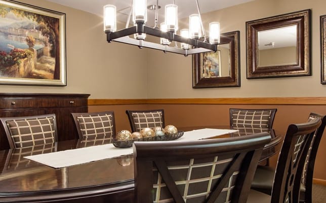 Elegant dining room with a large table and artwork