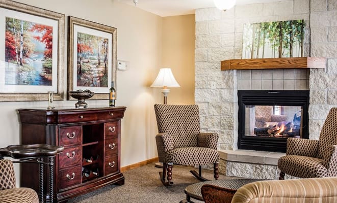 Cozy common area with seating and fireplace