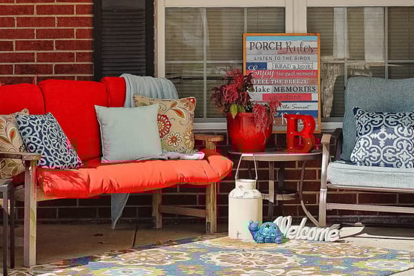 Colorful porch seating with cushions and decorative elements