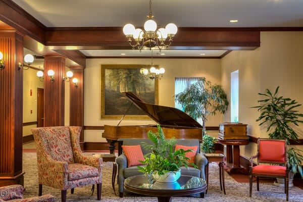 Lobby area with seating and a grand piano