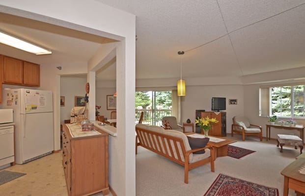 Spacious living room with seating and natural light
