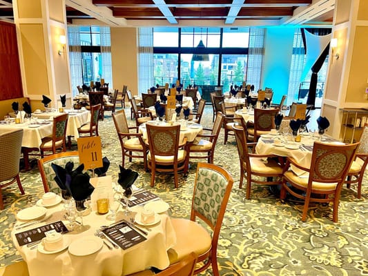 Elegant dining room setup with tables and chairs