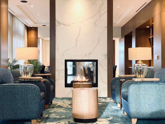 Cozy common area with seating and a fireplace