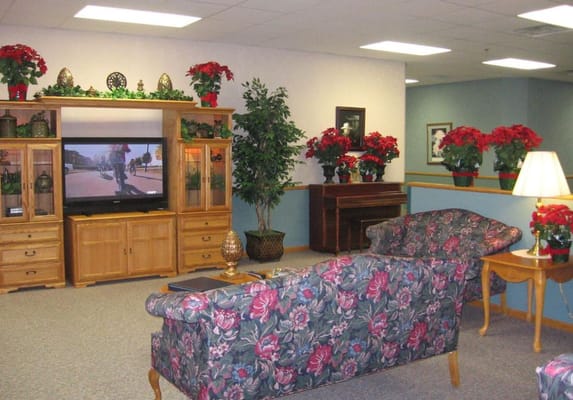 Cozy common area with floral decor and television