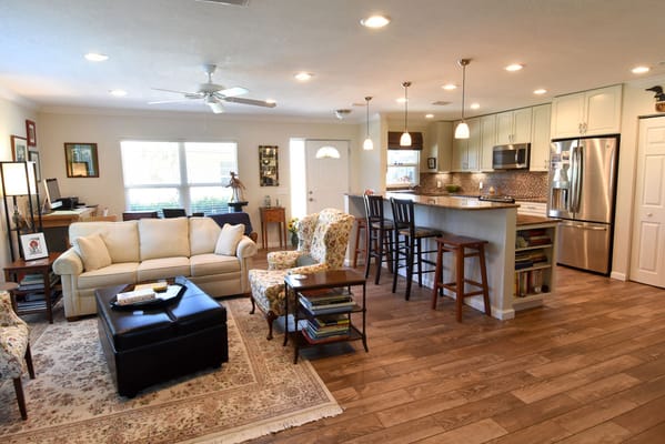 Bright common area with seating and kitchen space